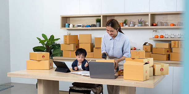 istock Mom managing home business while son studies nearby 2229047972