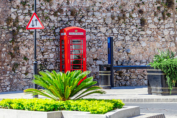 A classic red telephone box, traditional to the UK.