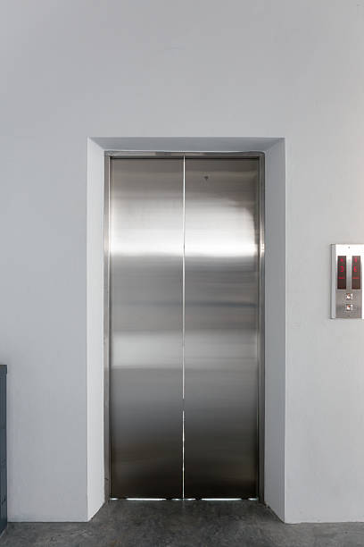 istock Elevator door and concrete floor in high rise building. 2229048254