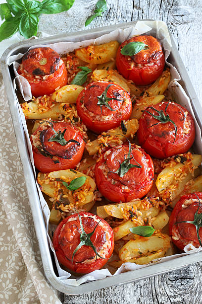 istock Tomatoes stuffed with rice and baked potatoes. 2229049320