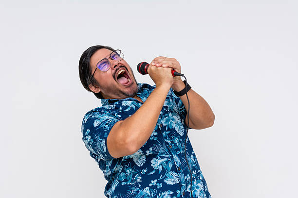 istock A rowdy and possibly drunk middle aged tourist shouting into the microphone during a fun karaoke night. 2229049704