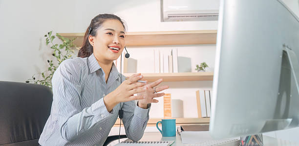 istock Remote Work. Smiling woman conducting virtual meeting from home office. 2229050138