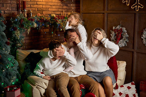 istock Happy Family Playing a Christmas Game 2229050551