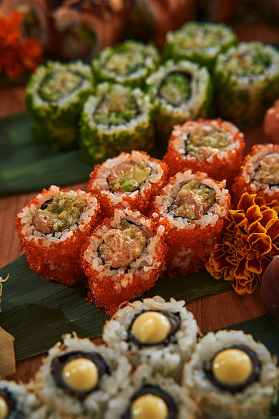 istock A Colorful Array of Sushi Rolls Displayed on a Wooden Platter, Showcasing a Variety of Ingredients and Flavors in Artistic Presentation 2229051920