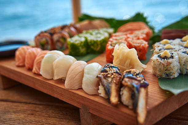 A Beautifully Presented Sushi Platter Featuring an Array of Freshly Made Rolls and Slices of Fish, Perfect for Any Seafood Lover's Delight By the Water
