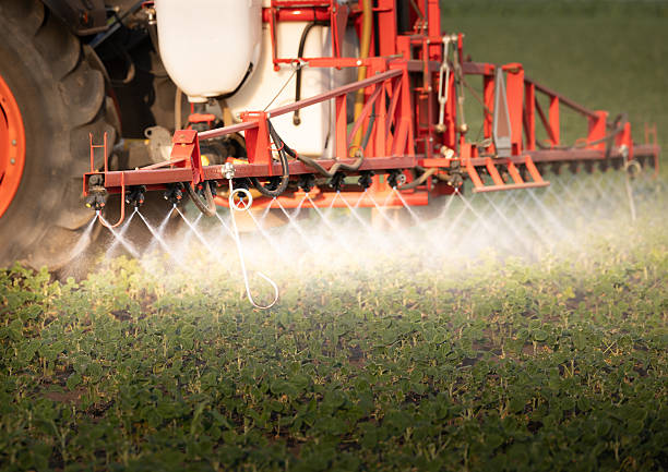 istock Tractor spraying soybean crops field 2229056242