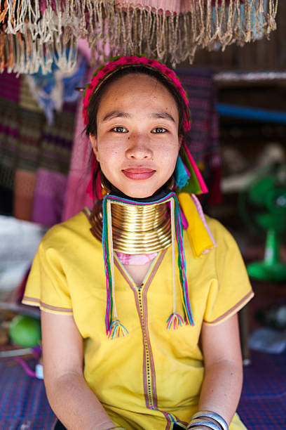 Pai, Chiang Mai, Thailand - May, 25, 2024: The Karen Long Neck Hill Tribe people, also know as the Kayan tribe people, are refugees from Burma, seeking better life in Thailand. They have a very distinct culture of wearing rings of brass around their necks.