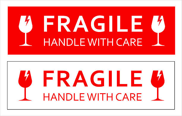 istock Vector red fragile - handle with care shipping sticker or label for packages in red and white design 2229061969