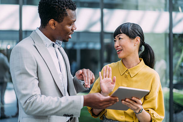 istock Business people using digital tablet outdoors. 2229062203