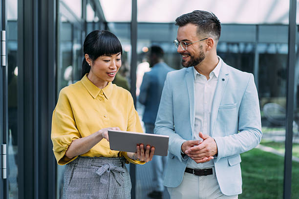 istock Business people using digital tablet outdoors. 2229062216