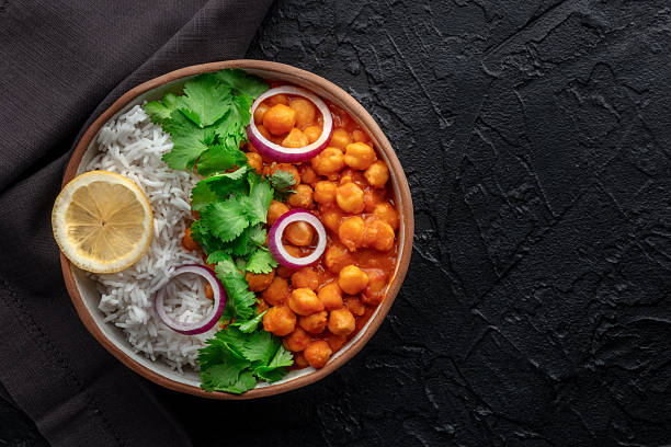 istock Chana masala, chickpea curry, traditional Indian dish, overhead flat lay shot 2229062587