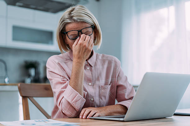 istock Stressed businesswoman using laptop at home. 2229065807