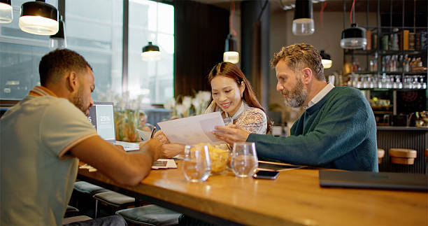 istock Diverse Business Professionals Collaborating at Coffee Corner in Modern Office 2229067397