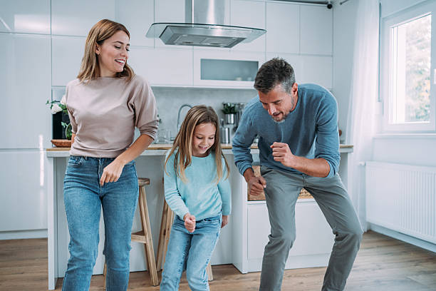 istock Family dancing in living room. 2229068644