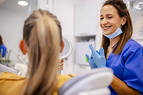 istock Smiling dentist interacts with patient in modern healthcare setting during routine dental checkup 2229073082