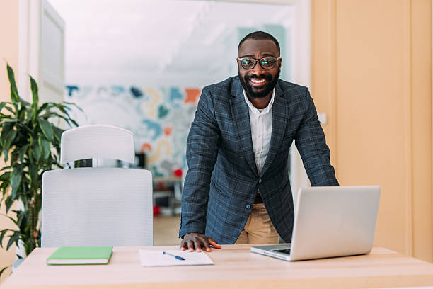 istock Successful businessman in modern office working on laptop. 2229073731