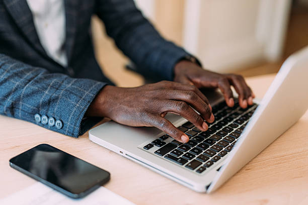 istock Successful businessman in modern office working on laptop. 2229073735