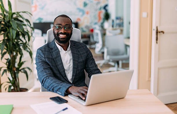 istock Successful businessman in modern office working on laptop. 2229073736
