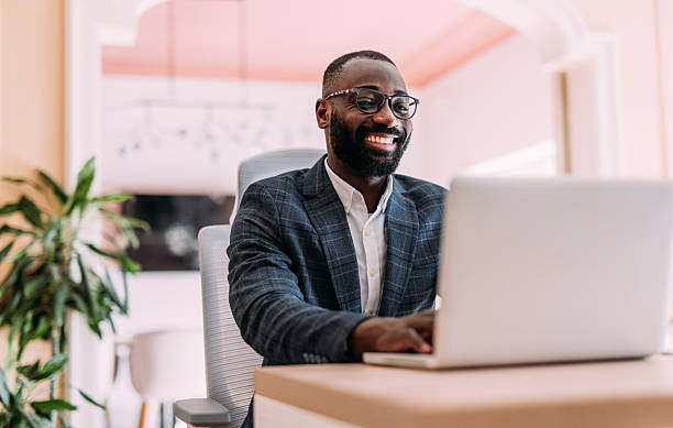 istock Successful businessman in modern office working on laptop. 2229073740