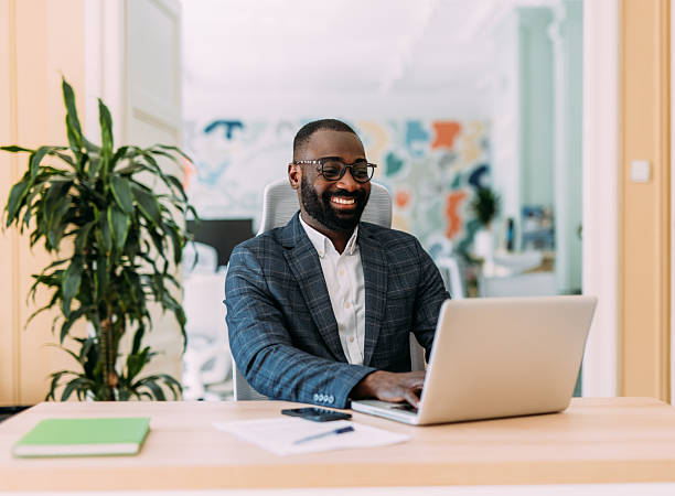 istock Successful businessman in modern office working on laptop. 2229073742