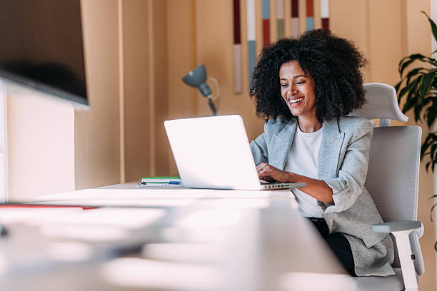 istock Successful businesswoman in modern office working on laptop. 2229073751
