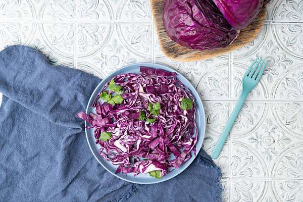 istock Red cabbage salad with fresh green cilantro on a plate. 2229074301