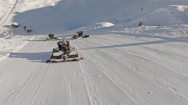 Snow cutter-blower machine for clearing thr roads of snow and ice parked along the Timmelsjoch high mountain pass. in the Austrian Alps of South Tirol.