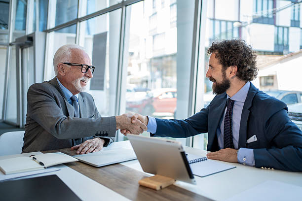 istock Two businessmen shaking hands after a successful meeting 2229080905