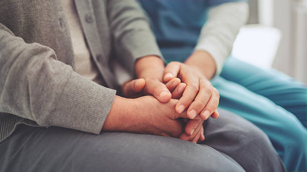 istock Healthcare worker consoling a patient 2229081790