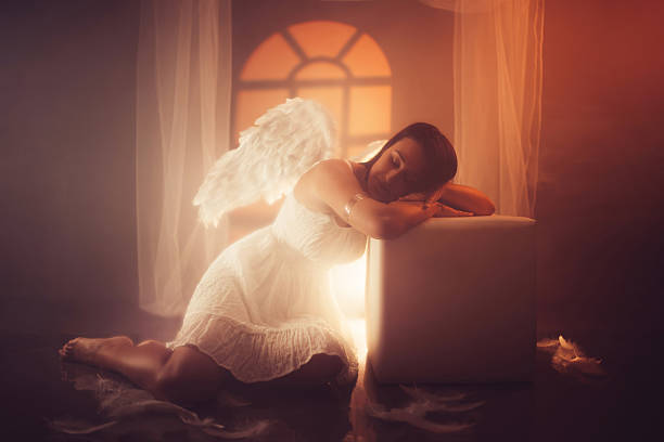 Baby angel with wings antique statue isolated.