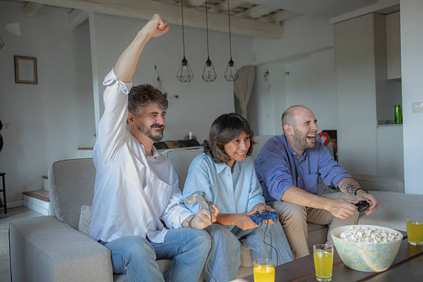 istock Friends Enjoying a Gaming Night at Home 2229083410
