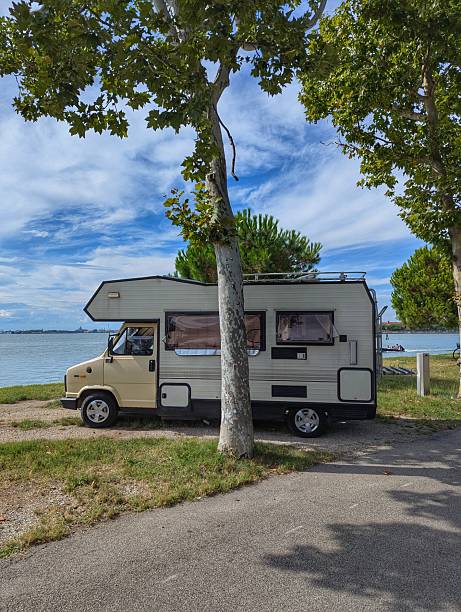 istock White Camper Van Near the Beach on Lido Island, Venice 2229083855