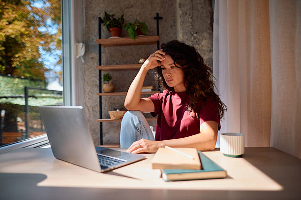 istock Stressed young woman working from home having problem with laptop 2229088429