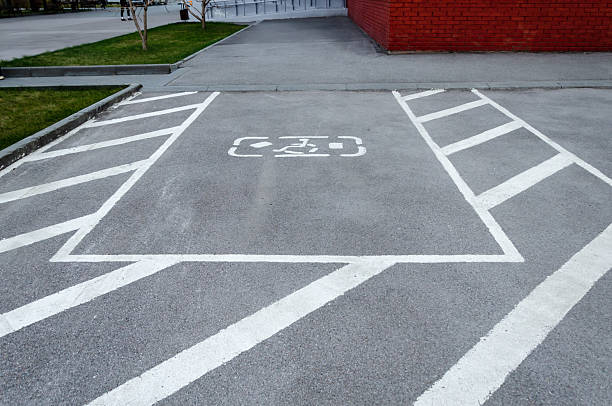 istock Disabled Parking Space Marking on Asphalt Road 2229090284