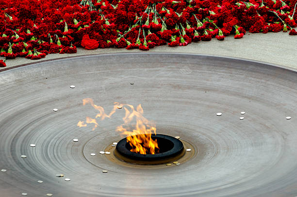 Close-up of real fire flames. Black background, space for copy.