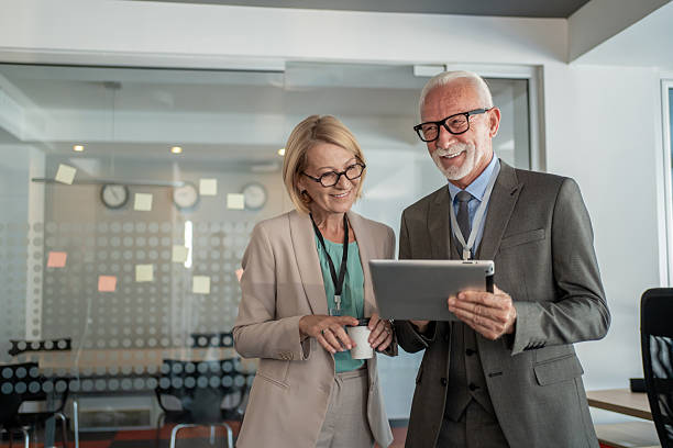 istock Senior business people using digital tablet in modern office 2229091006
