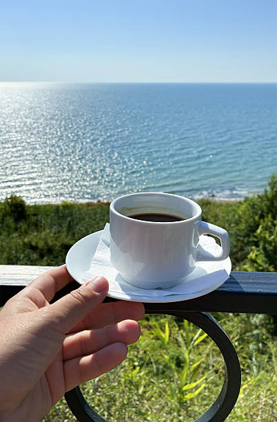 istock Cup of coffee against the sea 2229094598