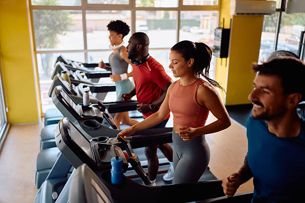 istock Group of athletes running on treadmill in a gym. 2229097230