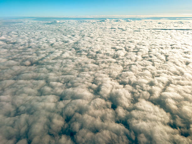 istock White clouds in blue sky. Aerial top view cloudscape. Texture of clouds. View from above. Sunrise or sunset over clouds. Panorama sky pattern 2229098358
