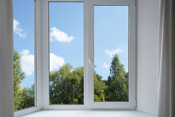 istock View from the window on the garden green trees. 2229098880
