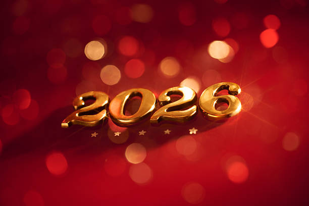istock Golden 2026 Numbers on Festive Red Background with Sparkling Bokeh Lights 2229108433