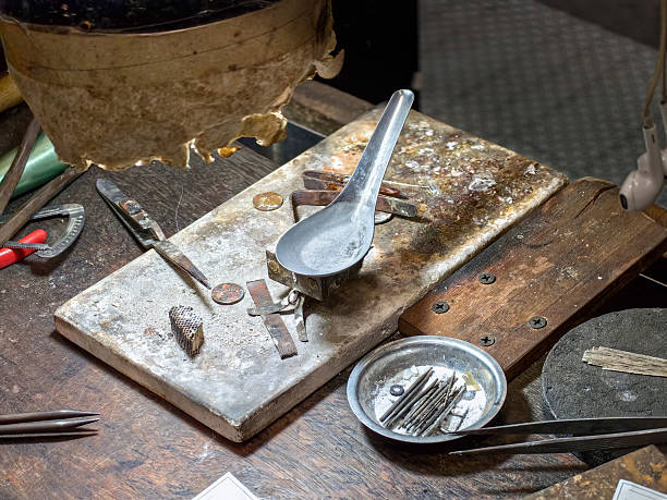 istock Surface of master jewelers table with tools. Mess on table 2229109156