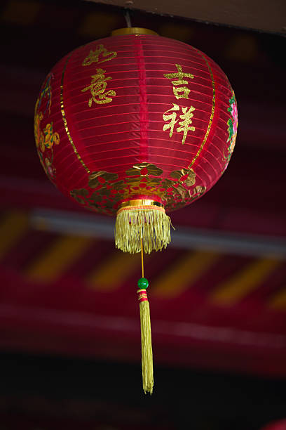 istock Festive Red Chinese Lanterns Hanging Gracefully at chinese shrine 2229110710
