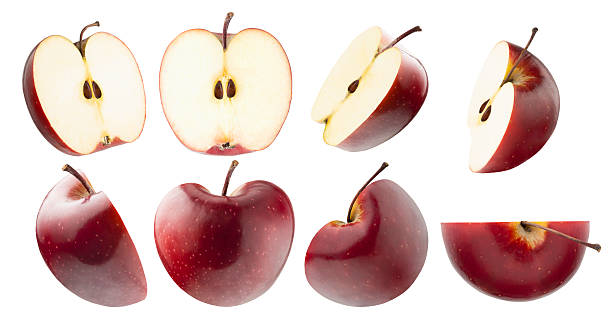 istock Juicy red apples rich set, bright red apples cut on half, with tails, seeds, different sides, studio shot, isolated on white background. Summer fresh natural fruits as design elements. 2229110780
