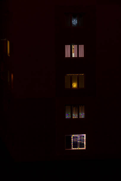 istock A large building adorned with many windows beautifully lit up during the night 2229110973