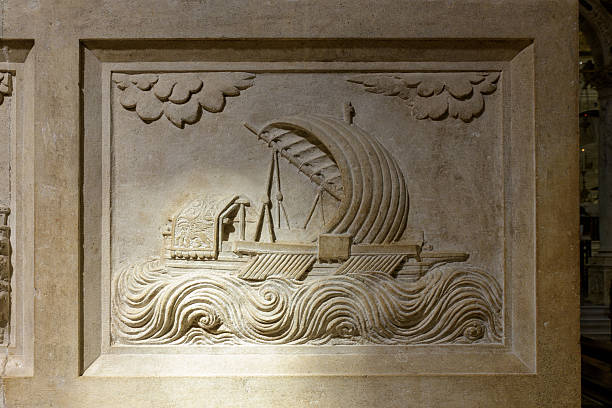 A bas-relief depicting a ship with a sail navigating waves, located in the Basilica di Sant'Antonio, Padua.