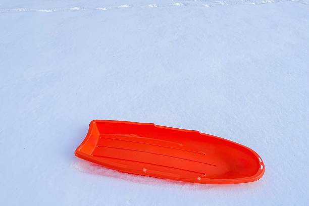 istock People enjoying snow sledding on a winter hill 2229116203
