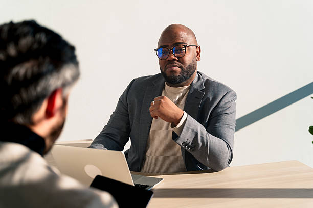 istock Latin american businessmen discussing a project in coworking space 2229118410