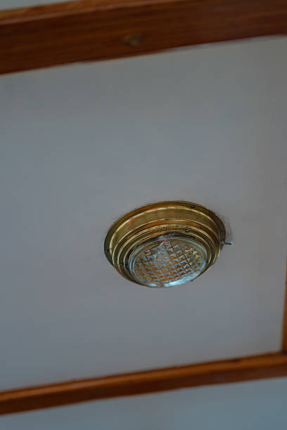 istock Brass Ceiling Light Fixture with Textured Glass on a Boat 2229119898