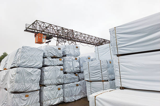 istock Products in packaging against the background of a loading crane. 2229120116